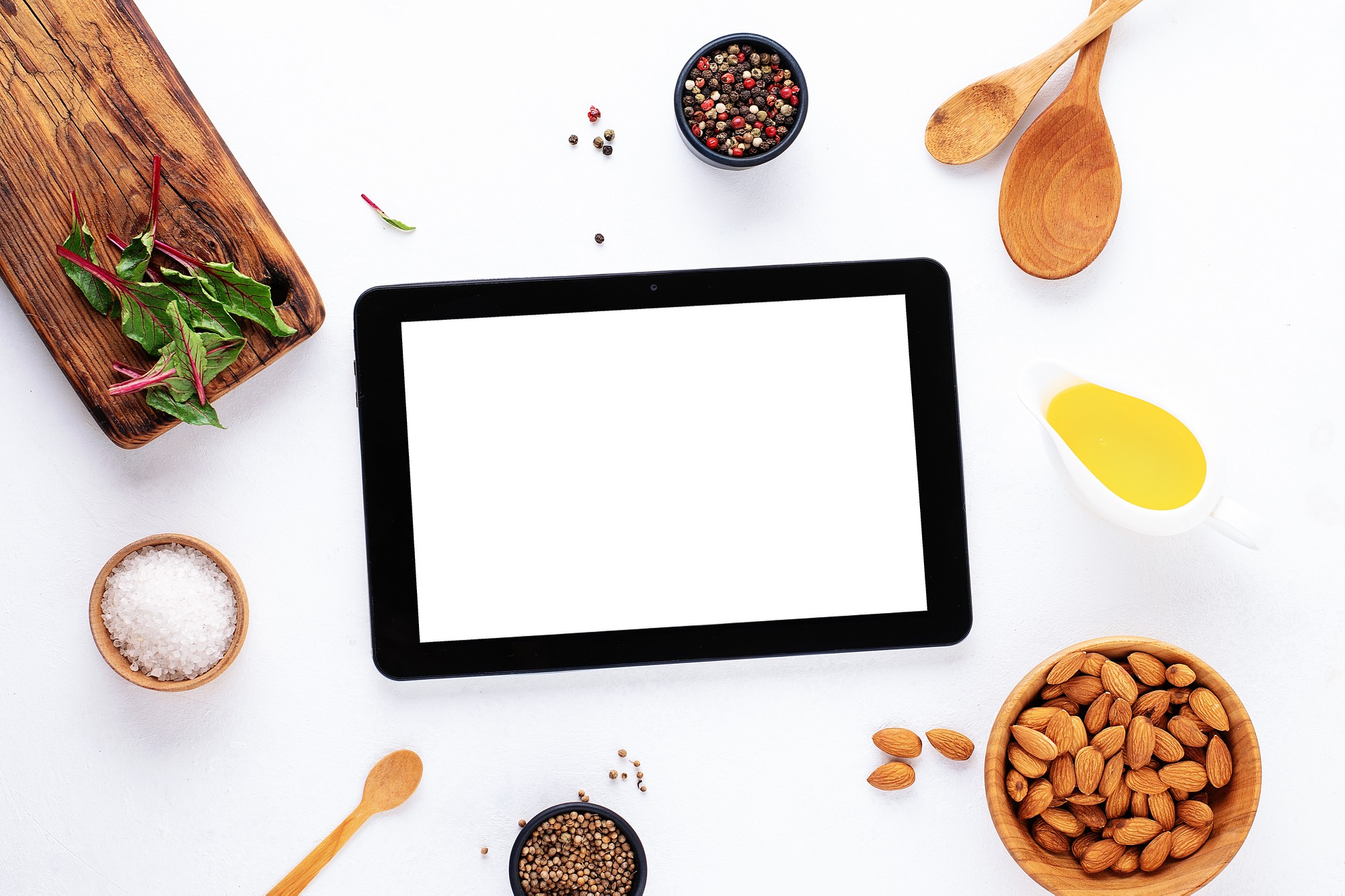 Large editorial shot of plated dish and tablet with recipe